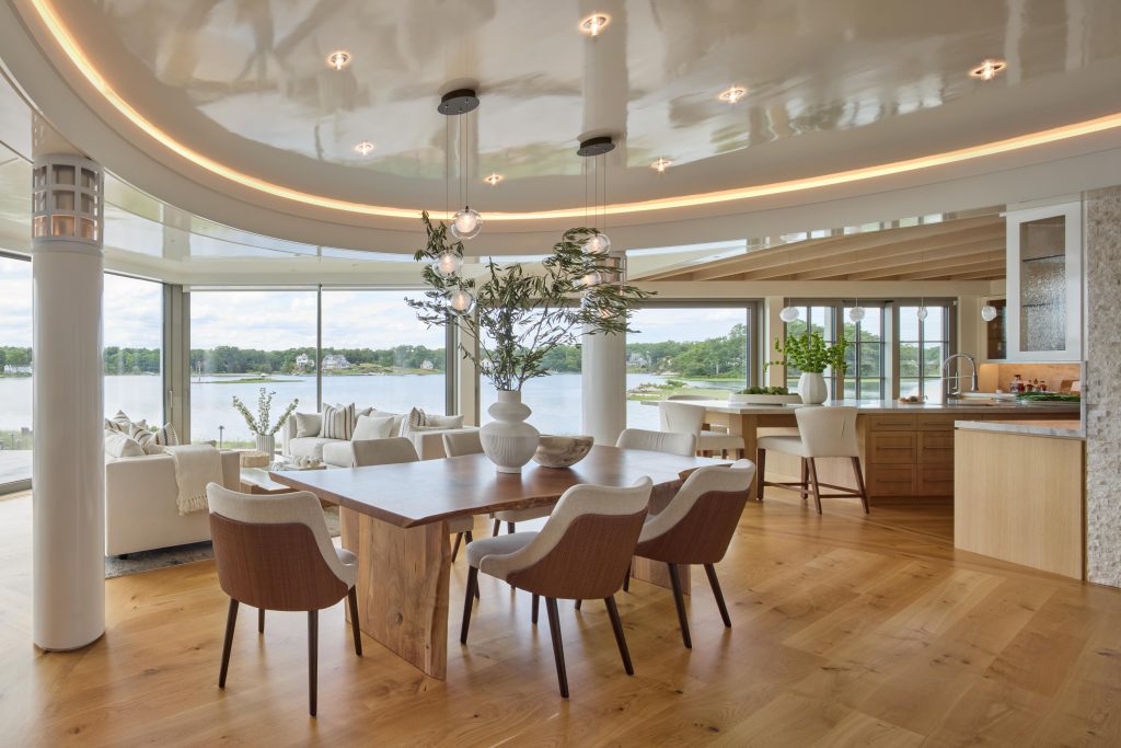 Coveledge kitchen, dining area, and lounge area with two couches